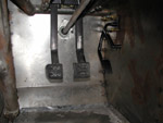 A picture of the pedals in the foot well