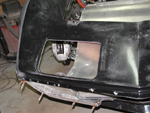 The first step was to cut the headlight openings in the bodywork