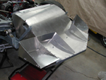 Once fitted under the bodywork, we fabricated them out of aluminum